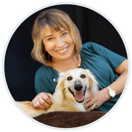 Jean Hamilton with her wonder dog Phoenix, both smiling for the Contact Page Image
